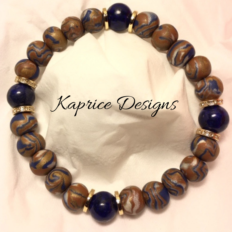 Handmade Bead Design: Made with four different, but complimentary Polymer Clay colors that gives an abstrat look to the beads. The handmade beads are paired with 4 Blue Lapis beads with a side of gold plated bling.